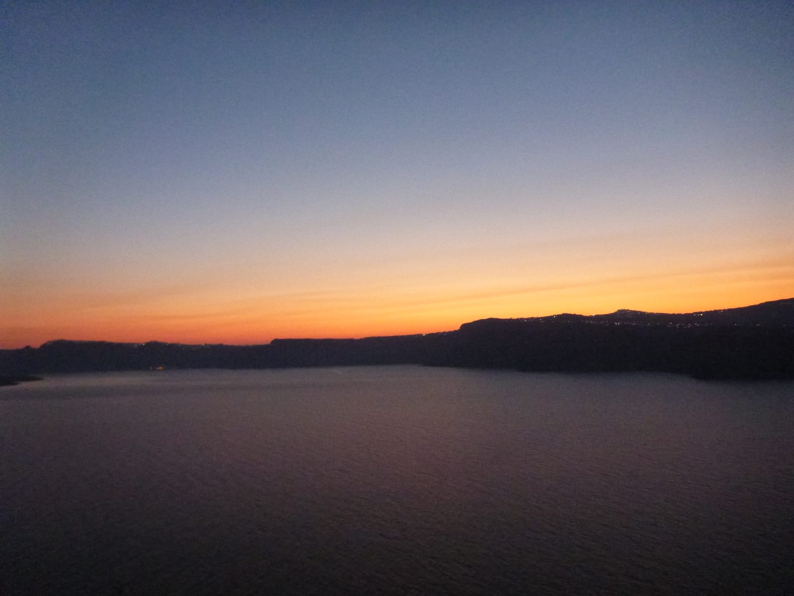 Sunrise over the caldera from Blu Rooms, Santorini, Greece