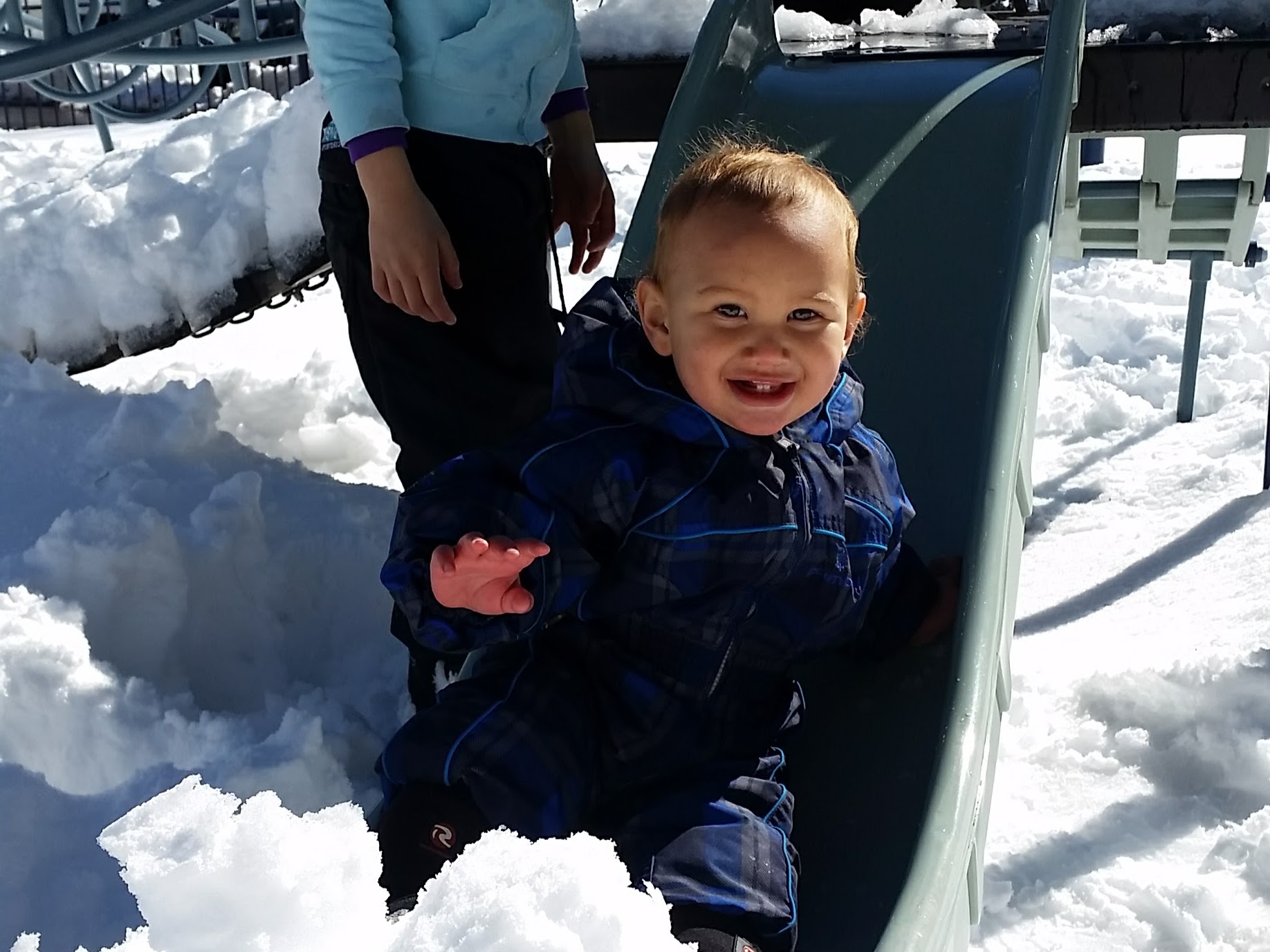 Happy Elijah playing in the snow at Perisher - World Travel Ambitions