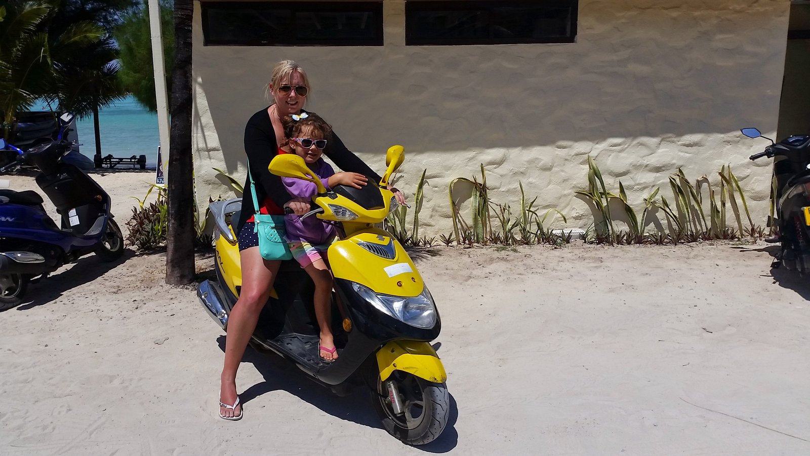 Family on a scooter in Rarotonga, Cook Islands