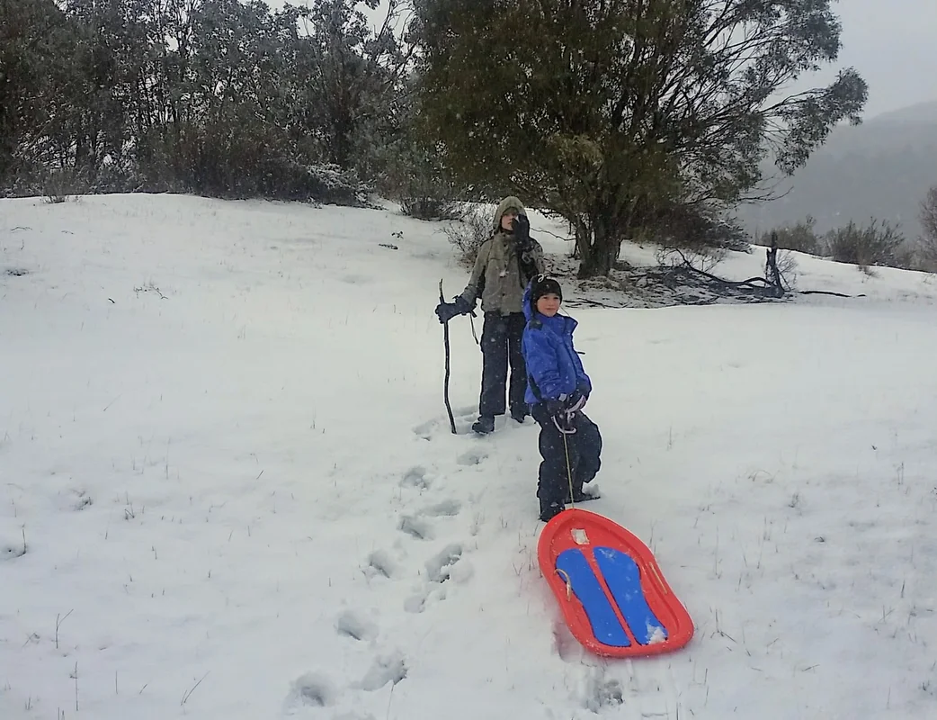 Toboggan at Perisher budget family skiing Australia travel - World Travel Ambitions